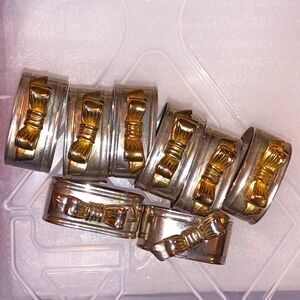 8 silver and gold napkin rings with bow